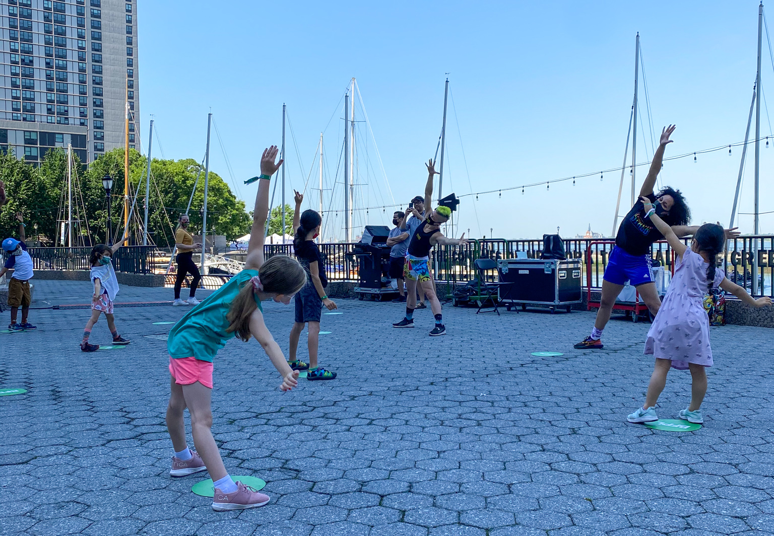 Students being lead in outdoor PopAction movement class