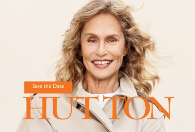 Action Maverick Award Save the Date Image of Lauren Hutton smiling and wrapped in a trench coat with the words Save the Date and Hutton written on top.